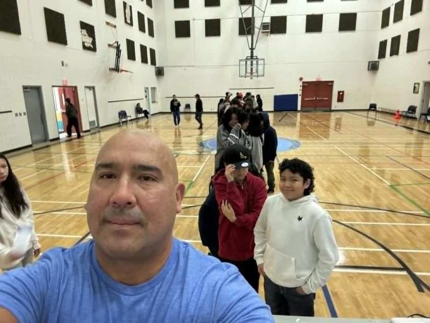 Carlin speaking to a full assembly — Lead Like a Teammate