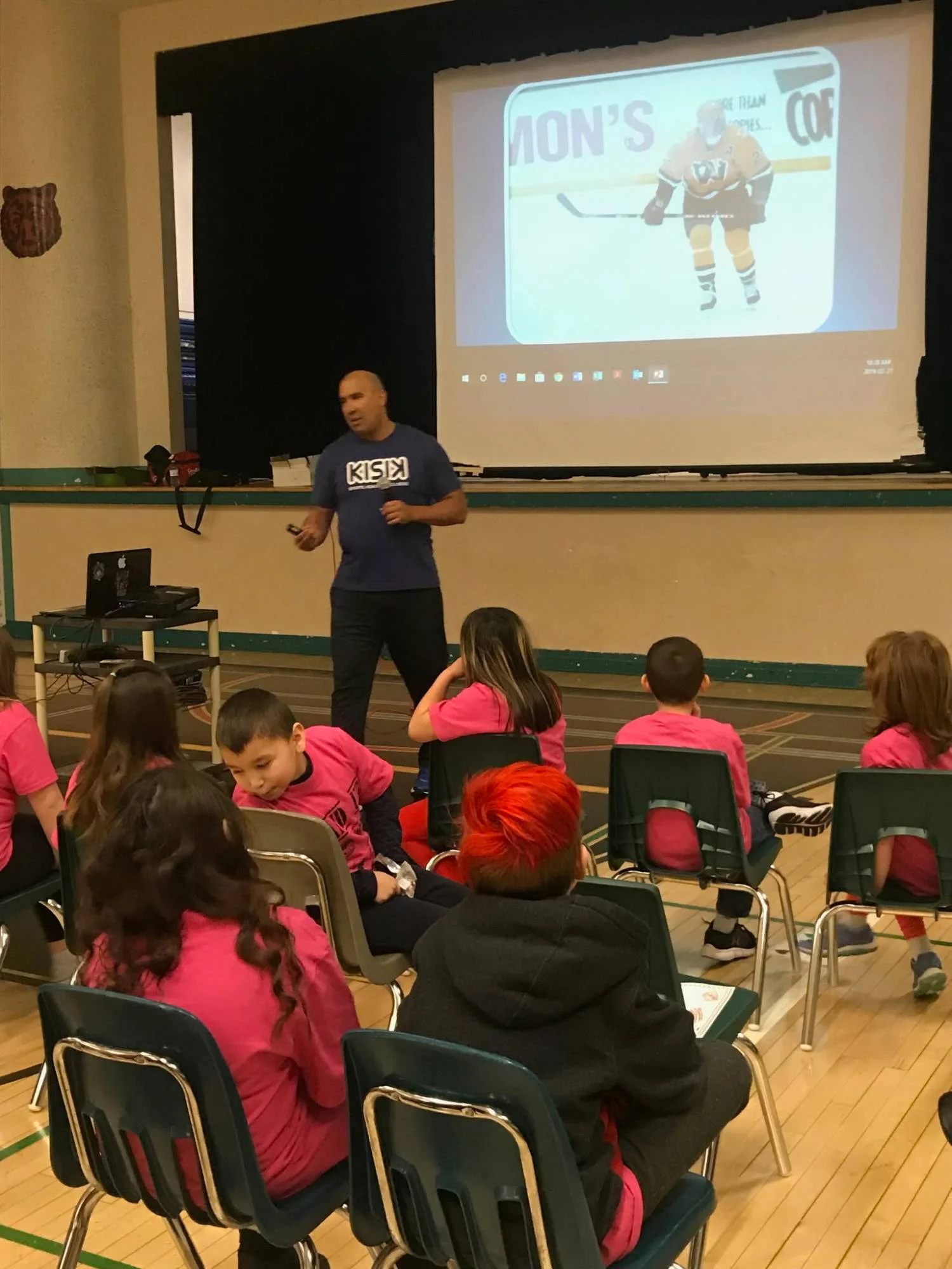 Carlin presenting his hockey journey — Build Belief